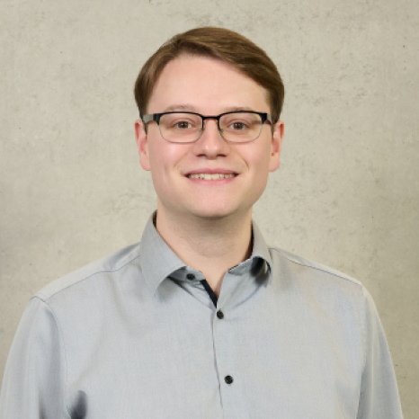 A simple, gray user icon on a light gray background, featuring a circle for a head and a rounded rectangle for the shoulders and body, often used as a placeholder for profile pictures at Hochschule Coburg. A simple, gray user icon on a light gray background, featuring a circle for a head and a rounded rectangle for the shoulders and body, often used as a placeholder for profile pictures at Hochschule Coburg.