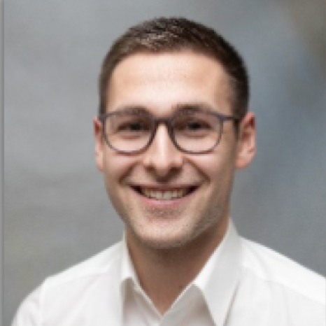 A simple, gray user icon on a light gray background, featuring a circle for a head and a rounded rectangle for the shoulders and body, often used as a placeholder for profile pictures at Hochschule Coburg.